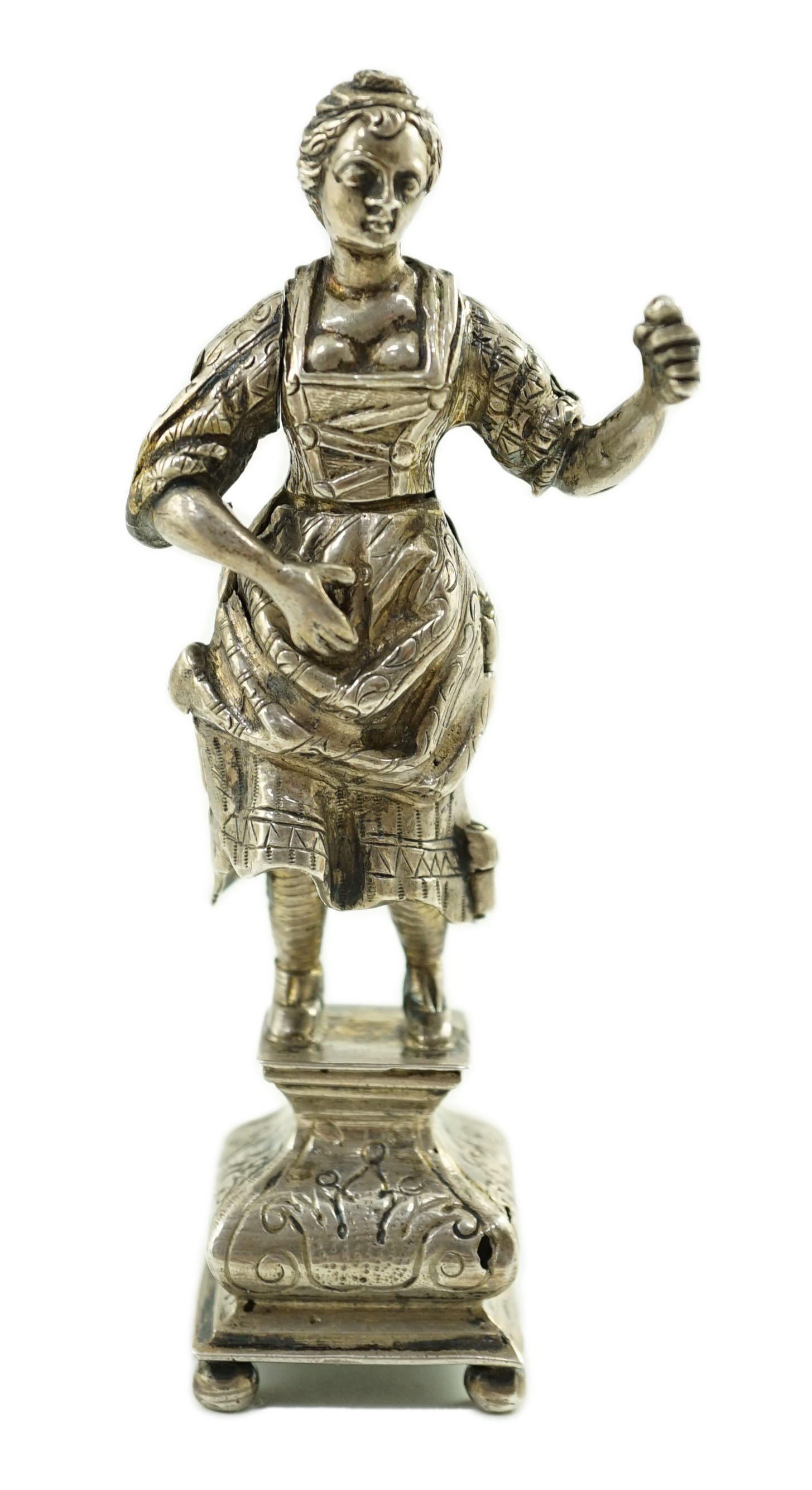 A late 19th century Dutch silver erotic miniature figure of a lady, on a square base with ball feet